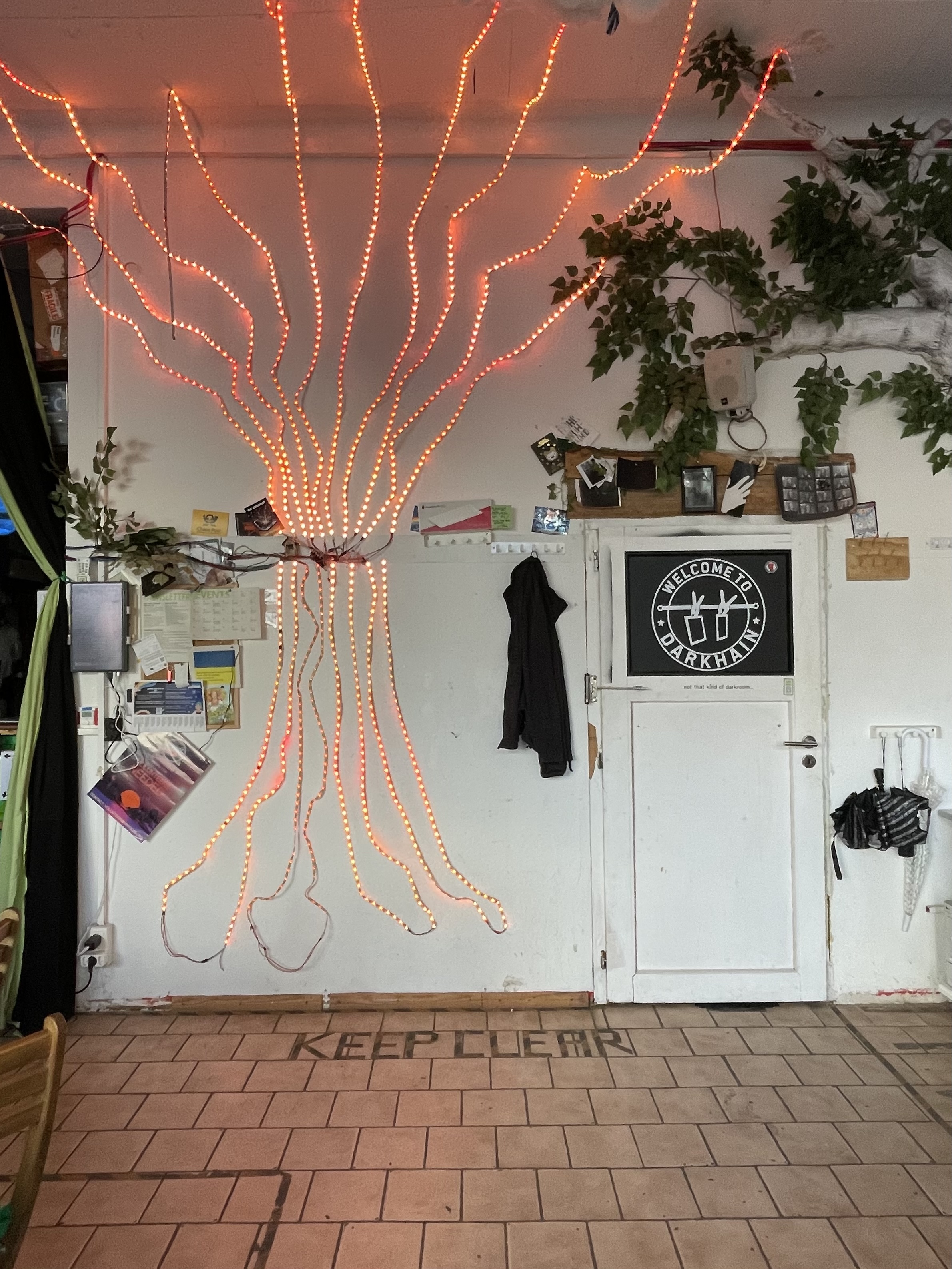 LED art installation on a 4m tall wall, a floor with tiles that's marked with tape